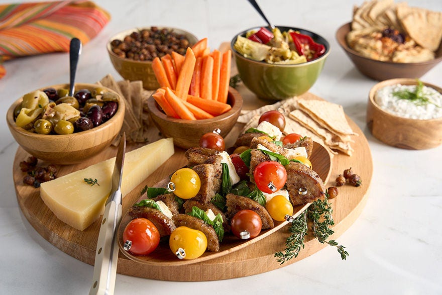 Mediterranean Charcuterie board with a variety of snacks 